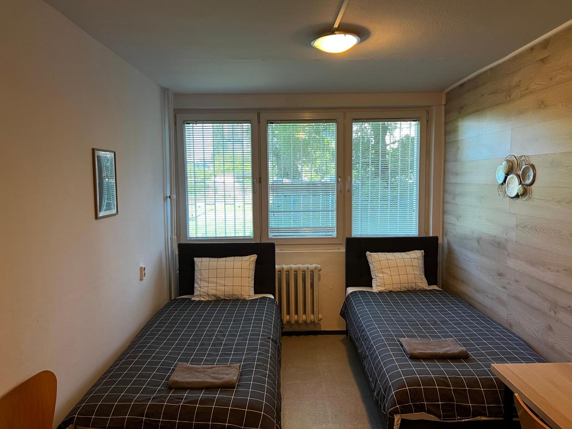 Quarto Twin com Casa de Banho Partilhada
